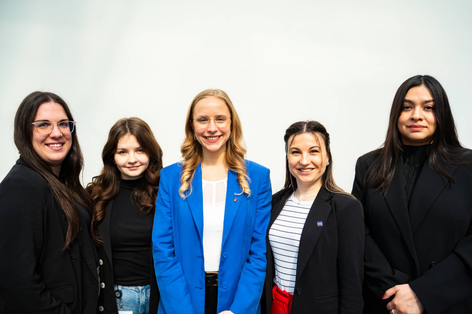 A professional business portrait of the MOA Berlin sales team against a white background.